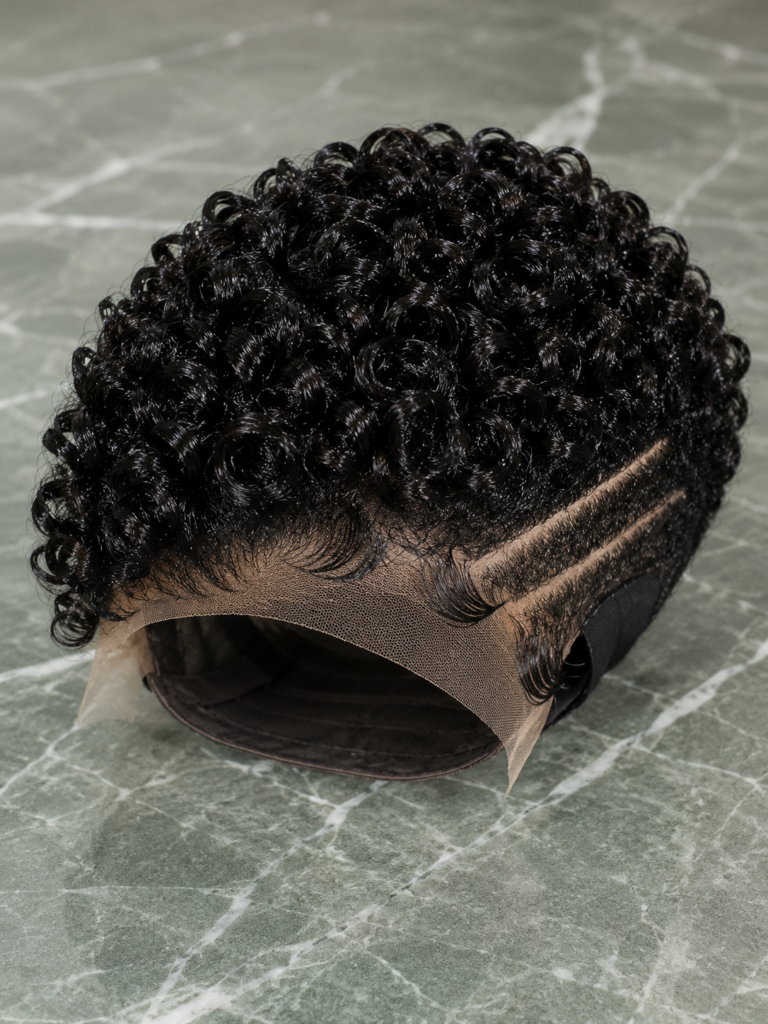 Precise Double Carving Elevates The Contrast Of Jet-Black Curls On Green Marble #naturalhair.hairstyles