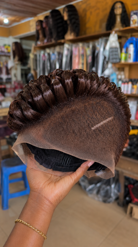 A Single Diagonal Razor Slash Sets The Tension Across A Dark Espresso Pompadour Pixie Wig #africanprintdesigners