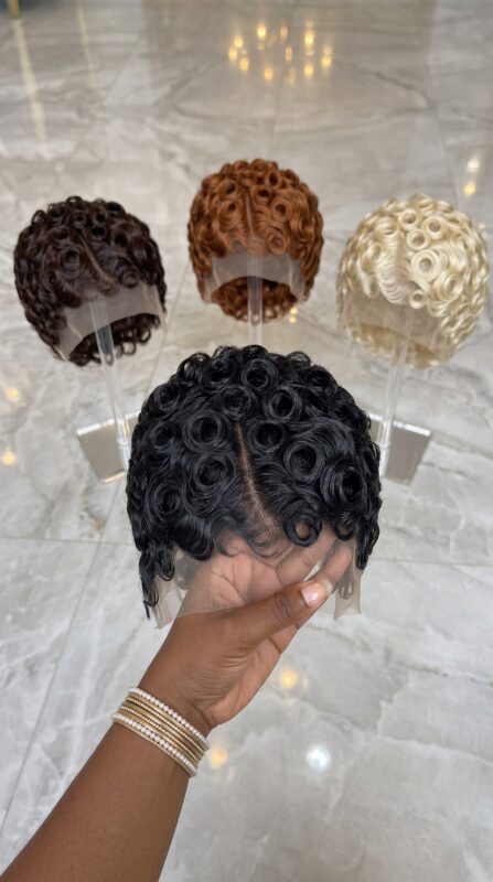 A Symmetrical Center Parting Accentuates Circular Swirl Pin-Curl Precision #braids.beautiess