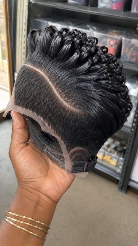 A Single Curved Razor Arch Anchors A Forward-Swept Ridge Pompadour On A Solid Obsidian Pixie Wig #hairstyleandfashionSC