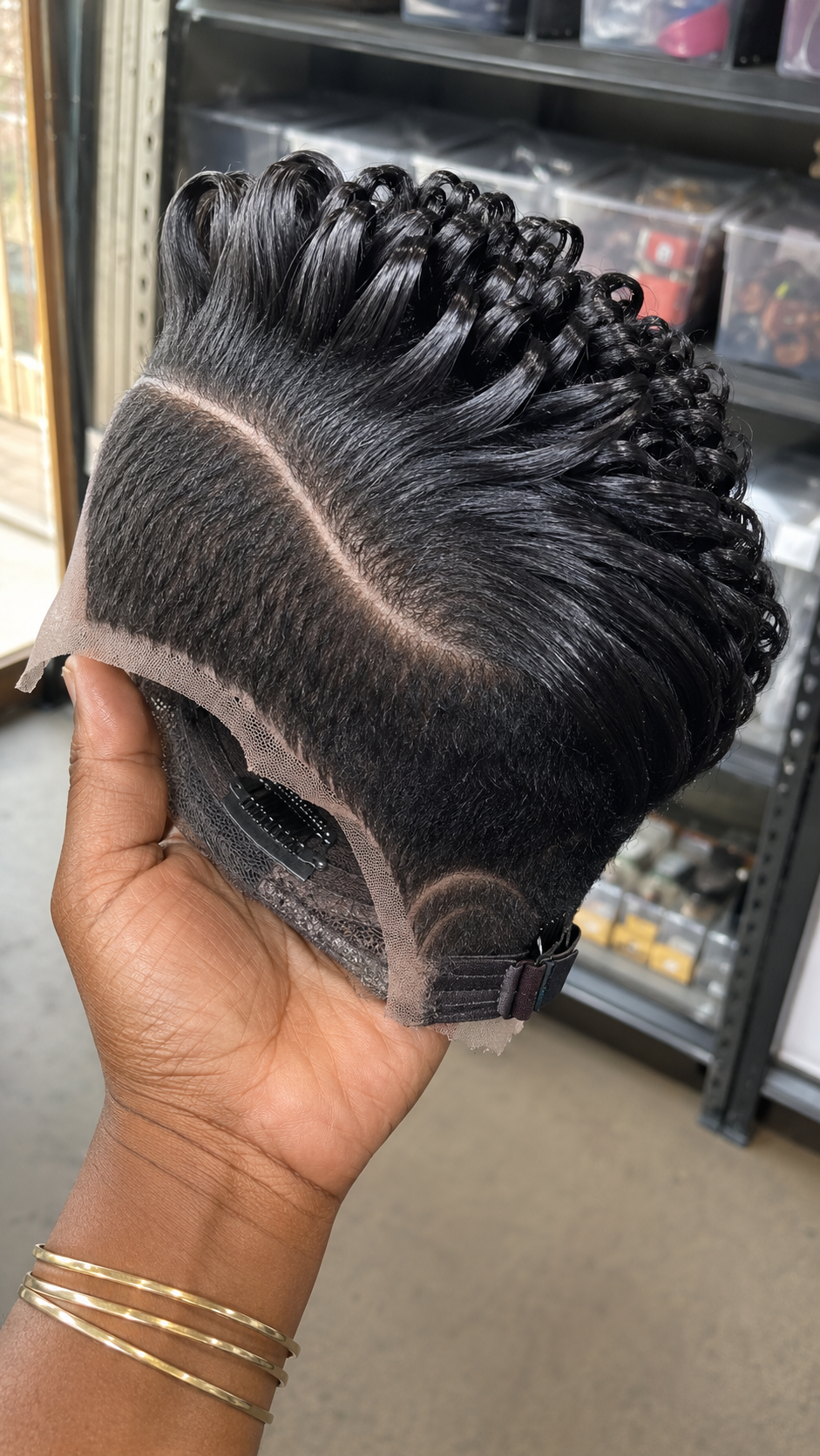 A Single Curved Razor Arch Anchors A Forward-Swept Ridge Pompadour On A Solid Obsidian Pixie Wig #hairstyleandfashionSC